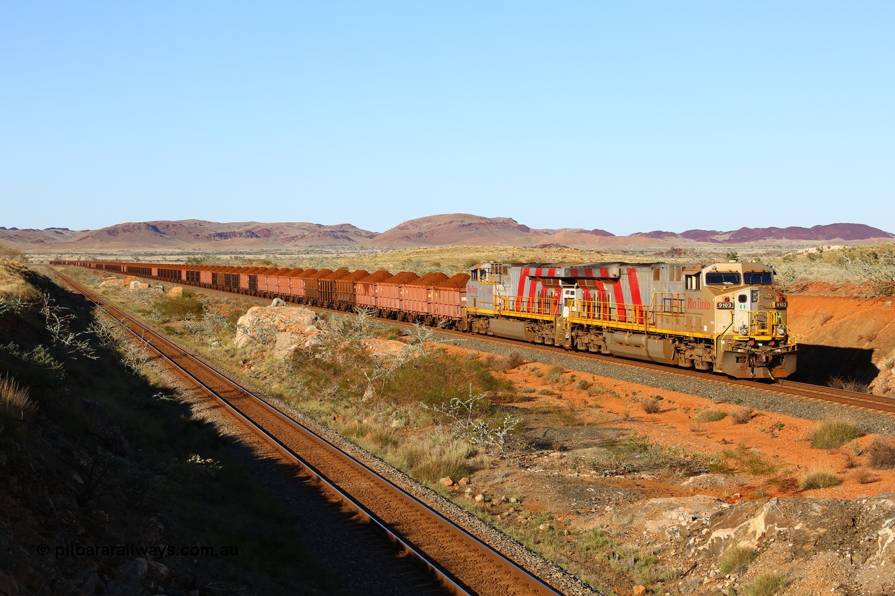 180616 1664
Cooya Pooya, 32 km on the Cape Lambert line, Rio Tinto loco 9103 with serial 61941 a GE Erie built GE model ES44ACi from the 1st order in Rio Tinto Stripes livery and 9108 serial 62539 are tied down on the West Mainline following a total loss of air. The train pulled a coupling around the 45 car position. 16th June 2018. [url=https://goo.gl/maps/ckyFypg4LAy]Geodata[/url]
Keywords: 9103;61941;GE;ES44ACi;Rio-Tinto-Stripes;