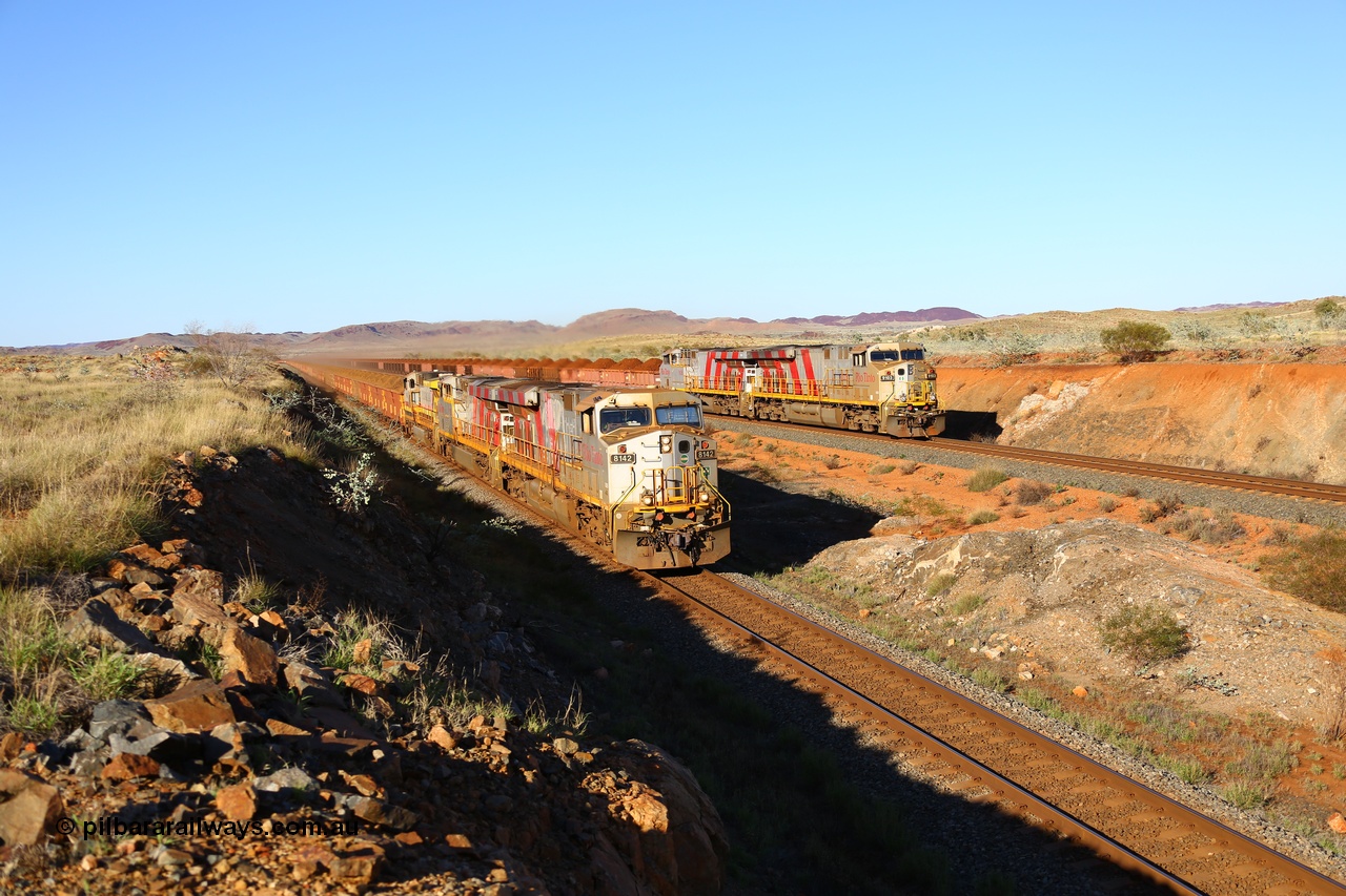 180616 1668
Cooya Pooya, at the 32 km on the Cape Lambert line a loaded HIY train on the East Mainline led by Rio Tinto loco 8142 with serial 58723 a GE Erie built GE model ES44DCi from the 3rd order in Rio Tinto Stripes livery as it powers past the disabled train stabled on the West Mainline with sister 8158 and Dash 9-44CW 9428 assisting 8142. 16th June 2018. [url=https://goo.gl/maps/LdE1Ly5DDHE2]GeoData[/url].
Toad Montgomery image.
Keywords: 8142;58723;GE;ES44DCi;Rio-Tinto-Stripes;