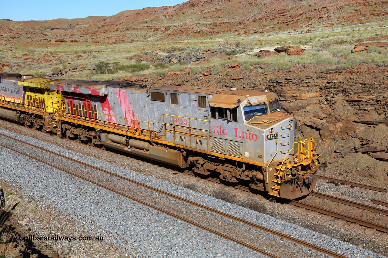 180616 1757
At the 81 km on the Tom Price West mainline, Rio Tinto loco 8133 with serial 59136 a GE Erie built GE model ES44DCi from the 2nd order in Rio Tinto Stripes livery, heavily faded from acid washing, is from the third order of these units built in June 2008 at GE's Erie plant. 16th June, 2018.
Keywords: 8133;59136;GE;ES44DCi;Rio-Tinto-Stripes;