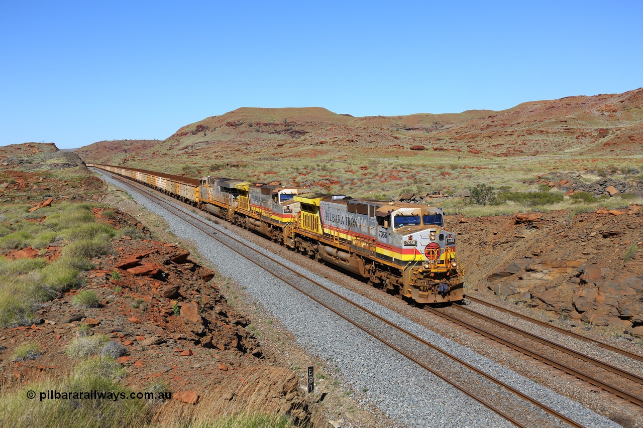 180616 1771
At the 81 km on the Tom Price West mainline, Rio Tinto loco 7056 with serial 55881 a GE Erie built GE model Dash 9-44CW from the 8th order in HI Pilbara Iron livery leads sister 7047 and ES44DCi unit 8115 in Rio Tinto silver with a loaded train of B and Q series waggons operating in AutoHaul™ as they approach Emu and then continue onto Dampier. 16th June, 2018. [url=https://goo.gl/maps/EkqHKXMxSHT2]GeoData[/url].
Keywords: 7056;55881;GE;Dash-9-44CW;HI-Pilbara-Iron;