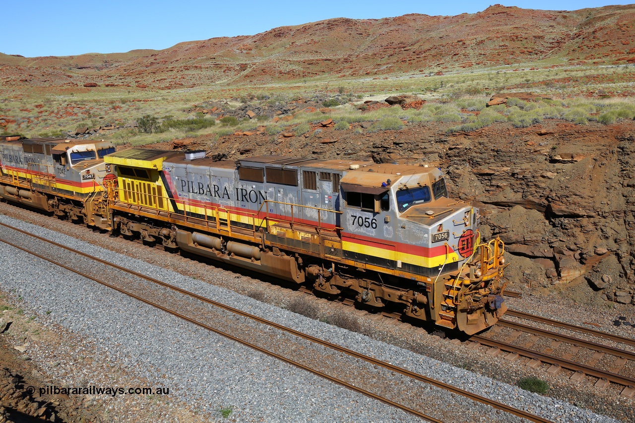 180616 1772
At the 81 km on the Tom Price West mainline, Rio Tinto loco 7056 with serial 55881 a GE Erie built GE model Dash 9-44CW from the 8th order in HI Pilbara Iron livery with heavy rust on the visor and the AutoHaul™ light has actually dislodged from the cab roof, this unit was from the eighth order of Dash 9-44CW units built at GE Erie in April 2005. 16th June 2018.
Keywords: 7056;55881;GE;Dash-9-44CW;HI-Pilbara-Iron;
