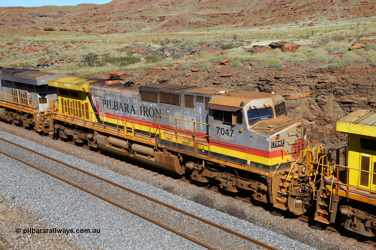 180616 1773
At the 81 km on the Tom Price West mainline, Rio Tinto loco 7047 with serial 57098 a GE Erie built GE model Dash 9-44CW from the 10th order in HI Pilbara Iron livery with heavy rust on the visor, was built in August 2006. 16th June 2018.
Keywords: 7047;57098;GE;Dash-9-44CW;HI-Pilbara-Iron;