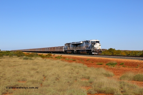 180615 1507
Indee Station road grade crossing 53.3 km, loaded Roy Hill train behind General Electric built ES44ACi model RHA 1007 serial 62579 and sister unit RHA 1010 with the mid-train units visible in the distance. [url=https://goo.gl/maps/teDNtwntmYR2]GeoData[/url]. 15th June 2018.
Keywords: RHA-class;RHA1007;ES44ACi;GE;62579;