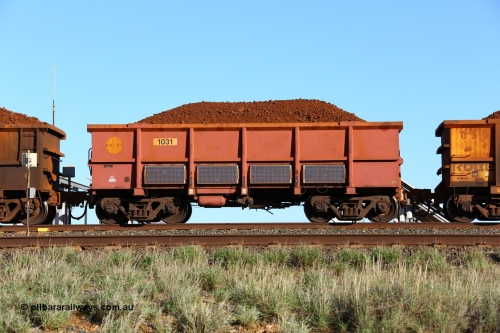 180616 1679
Cooya Pooya, instrumented ore waggon 1031, part of a second batch of extra 'J' waggons built by Bradken in September 2008 and painted rather than the plain steel finish. Solar panels adorn the waggon sides. 16th June 2018. [url=https://goo.gl/maps/PW31kLARES92]GeoData[/url].
Keywords: 1031;J-series;Bradken-NSW;Robe-ore-waggon;