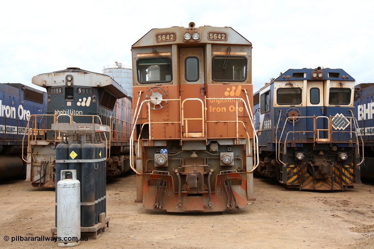 160128 00383
Wedgefield, Sims Metal yard, lined up waiting biding their time, three years separate these Goninan rebuilds CM40-8M unit 5642 serial 8281-07/92-131 and final unit 5669 CM40-8MEFI model serial 8412-02/95-160. The only differences visible are the pressed metal handbrake wheel and cast one, snow plough of 42 and the marker lights on 69.
Keywords: 5642;Goninan;GE;CM40-8M;8281-07/92-131;rebuild;AE-Goodwin;ALCo;C636;5467;G6041-3;