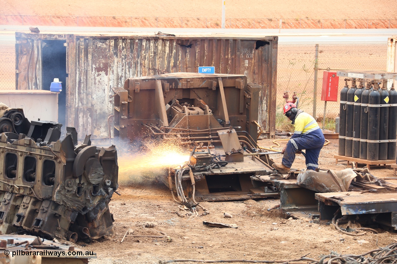 160128 00429
Wedgefield, Sims Metal Yard, the sparks fly as the remains on an ALCo frame are thermal lanced into smaller manageable pieces, a GE V16 7FDL-16 engine is also cut in half.
Keywords: CM40-8M;7FDL-16;Goninan;GE;