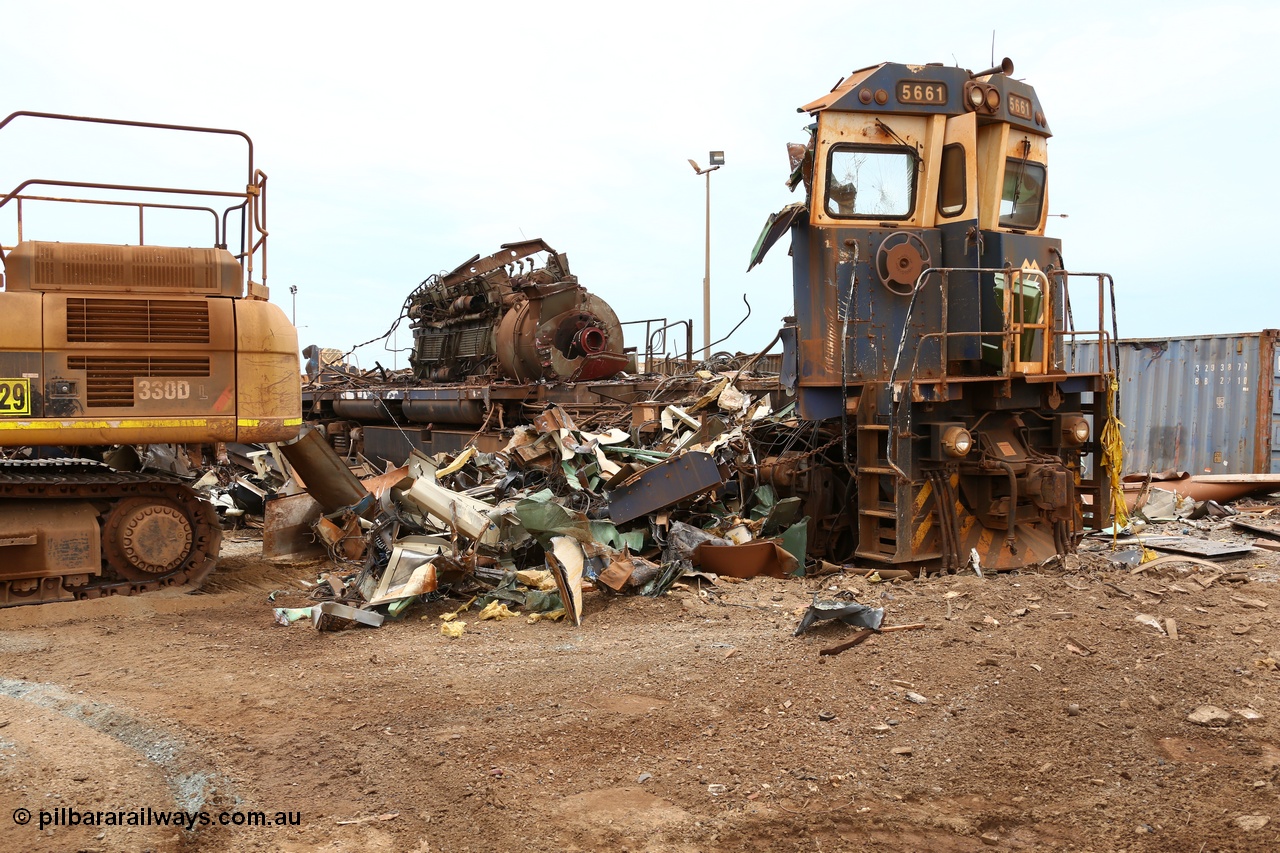 160128 00875
Wedgefield, Sims Metal Yard, reduced to just the front wall and the 7FDL-16 engine sticking above frame level, BHP Billiton Goninan rebuild CM40-8M locomotive 5661 serial 8412-06/94-152 is almost gone.
Keywords: 5661;Goninan;GE;CM40-8M;8412-06/94-152;rebuild;Comeng-NSW;ALCo;M636C;5488;C6084-4;