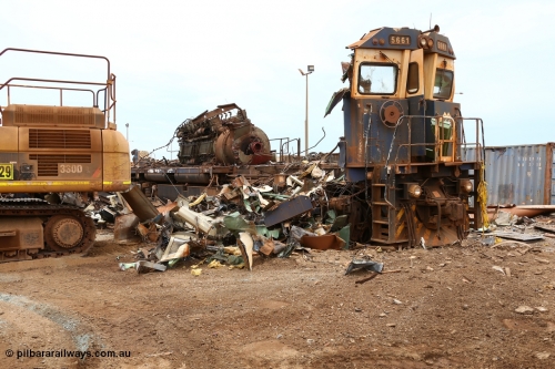 160128 00875
Wedgefield, Sims Metal Yard, reduced to just the front wall and the 7FDL-16 engine sticking above frame level, BHP Billiton Goninan rebuild CM40-8M locomotive 5661 serial 8412-06/94-152 is almost gone.
Keywords: 5661;Goninan;GE;CM40-8M;8412-06/94-152;rebuild;Comeng-NSW;ALCo;M636C;5488;C6084-4;