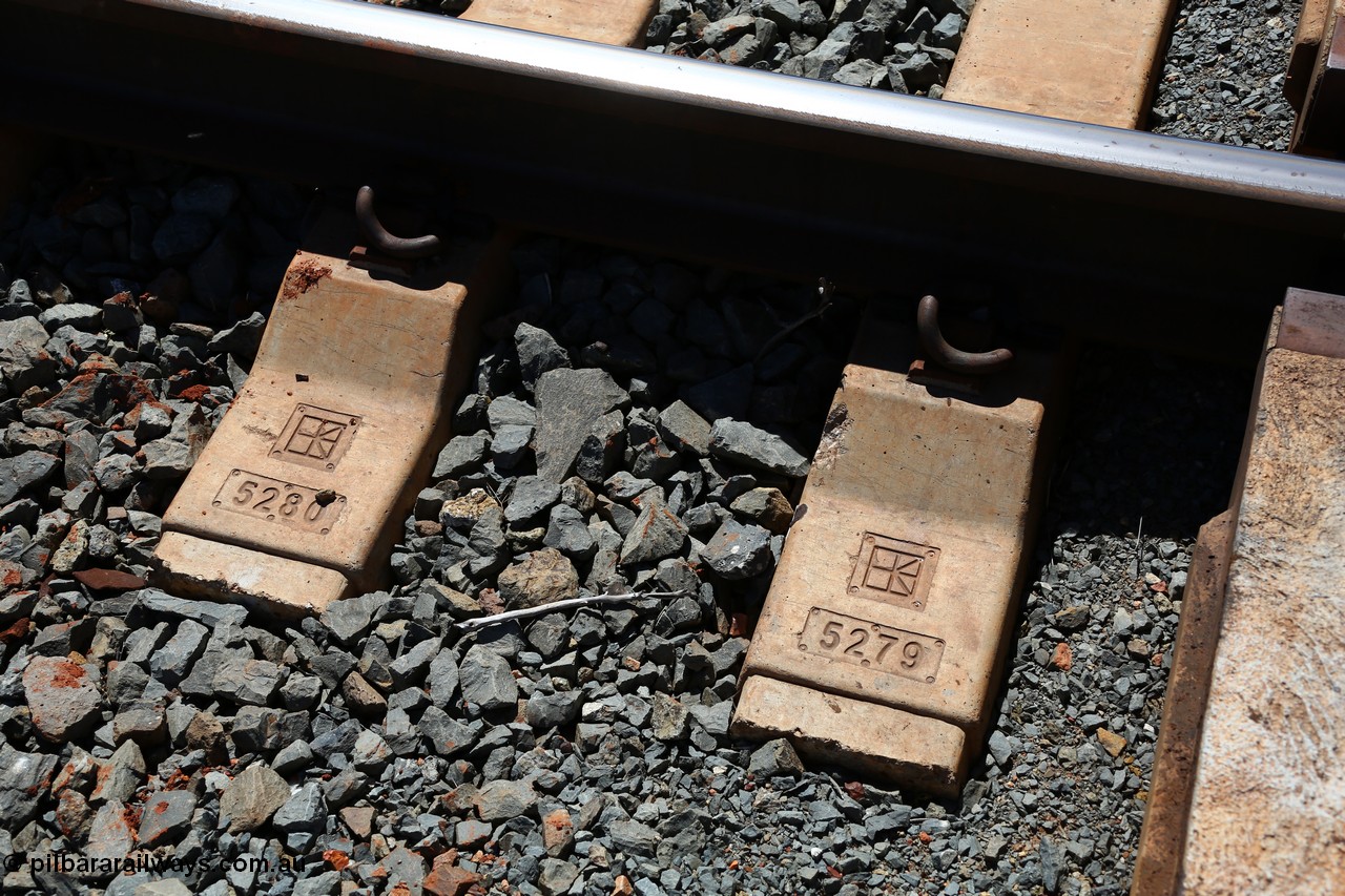 150505 7949
FMG Solomon Line track - sleeper detail. The logo stamped in the sleeper is for Austrak the manufacturer and the running number for the quality control.
