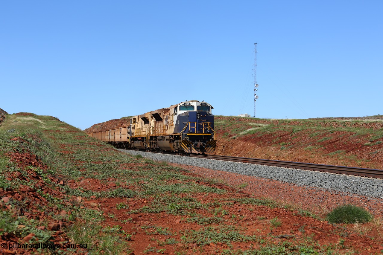 150505 7990
FMG Solomon Line, bank engines Progress Rail EMD SD70ACe/LCi unit 716 serial 20118693-008 and EMD SD90MAC unit 901 serial 976833-1, this unit has been repowered with an 16-710G3 prime mover, at the 227 km as they bank the loaded train upgrade into the cutting, the train speed is now increasing as the front of the train has topped the grade. Geodata: [url=https://goo.gl/maps/gSzXJkmY3ux] -22.0187117 118.5850933 [/url].
Keywords: FMG-716;Progress-Rail-Muncie-USA;EMD;SD70ACe/LCi;FMG-901;SD90MAC-H2;