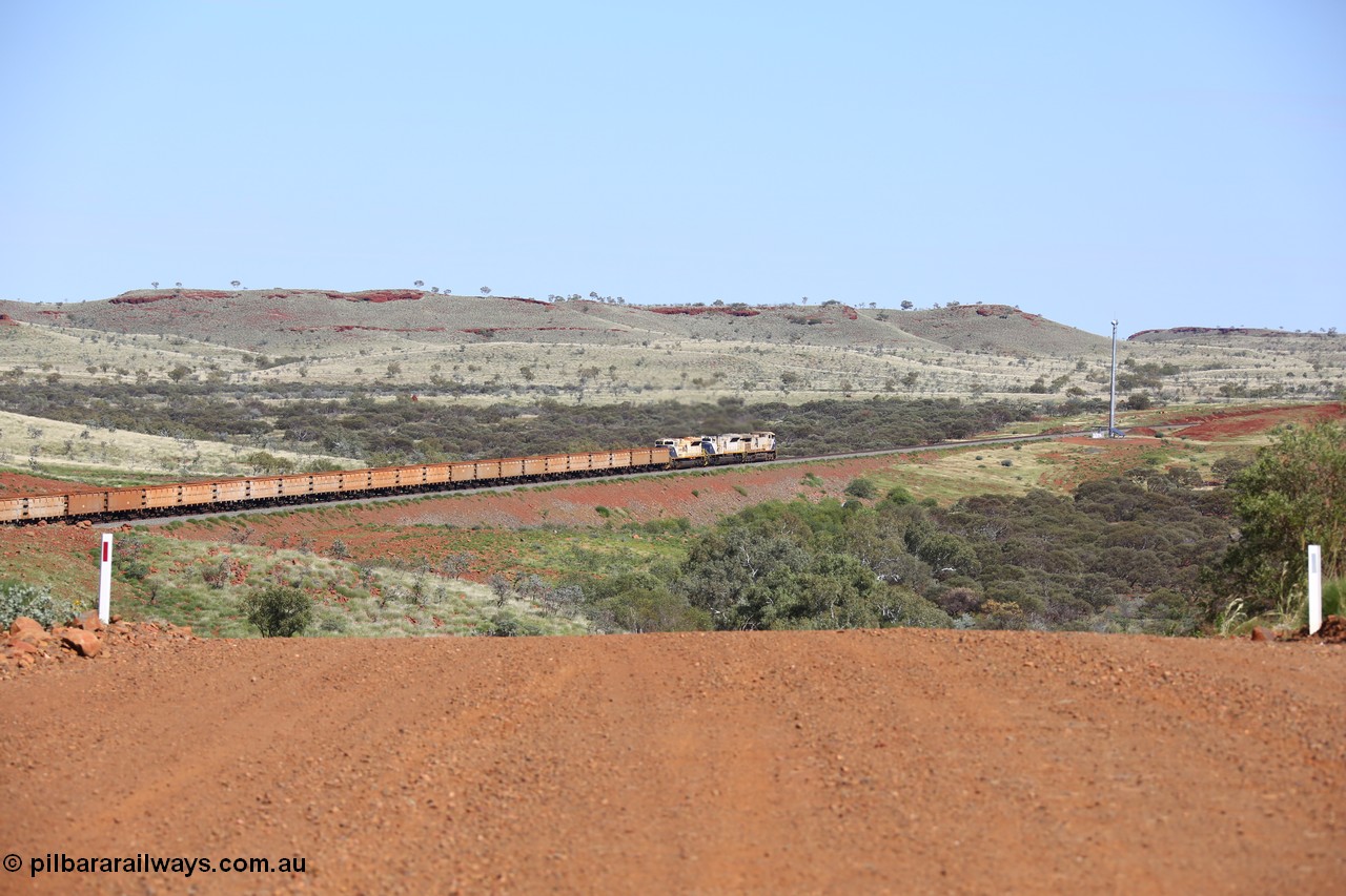 150508 8116
FMG Solomon Line, empty train lead by triple combination of General Electric Dash 9-44CW 004 serial 58181, EMD SD90MAC-H 916 serial 976833-22 and EMD SD70ACe 710 serial 20118693-002 power through the hills around the Bea Bea Creek area. Geodata: [url=https://goo.gl/maps/nBtezda3P8n] -22.0528200 118.7132450 [/url].
