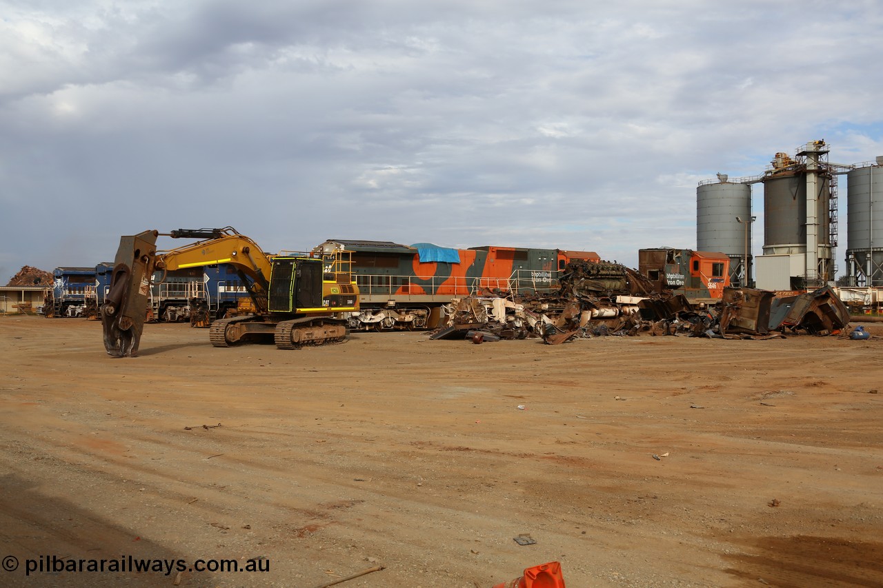 150522 8153
Wedgefield, Sims Metal yard, the first batch of BHP Billiton Dash 8 locos to be scrapped, 5646 serial 8244-11/92-135 one of a pair of new Goninan WA built CM40-8 units has already had most of the hood removed and the V16 7FDL prime mover is visible, sister unit 5647 sit along side with the same fate coming up next.
Keywords: 5646;Goninan;GE;CM40-8;8244-11/92-135;