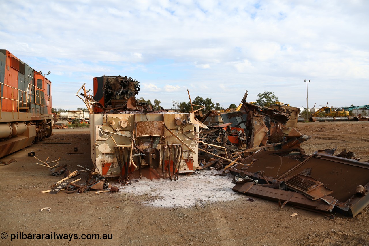 150522 8186
Wedgefield, Sims Metal yard, the first of BHP Billiton Dash 8 locos to be scrapped, CM40-8 5646 serial 8244-11/92-135 one of a pair of new Goninan WA built CM40-8 units has already had most of the hood removed and the V16 7FDL prime mover is visible, sister unit 5647 sits along side with the same fate coming up next. Full details of these units past lives [url=http://www.pilbararailways.com.au/bhp/loco/bhpb-roster.php] can be seen here [/url].
Keywords: 5646;Goninan;GE;CM40-8;8244-11/92-135;