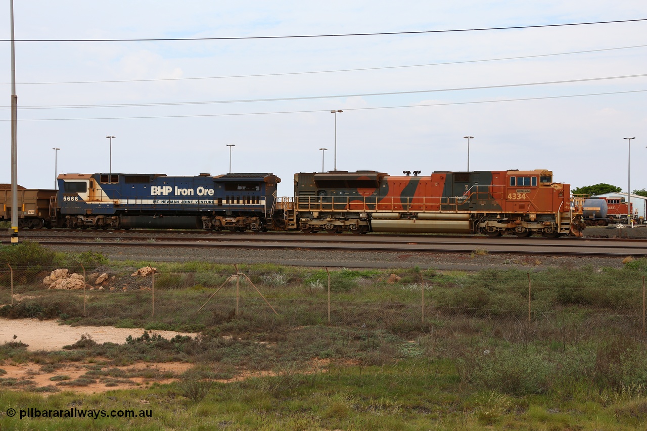 150523 8198
Nelson Point Yard, BHP Billiton SD70ACe unit 4334 'Wheelara' serial 20078915-001 built by Electro-Motive, London Ontario and Goninan rebuild CM40-8MEFI model unit 5666 'Taranto' serial 8412-11/94-157 wait on a loaded train in the arrival yard.
