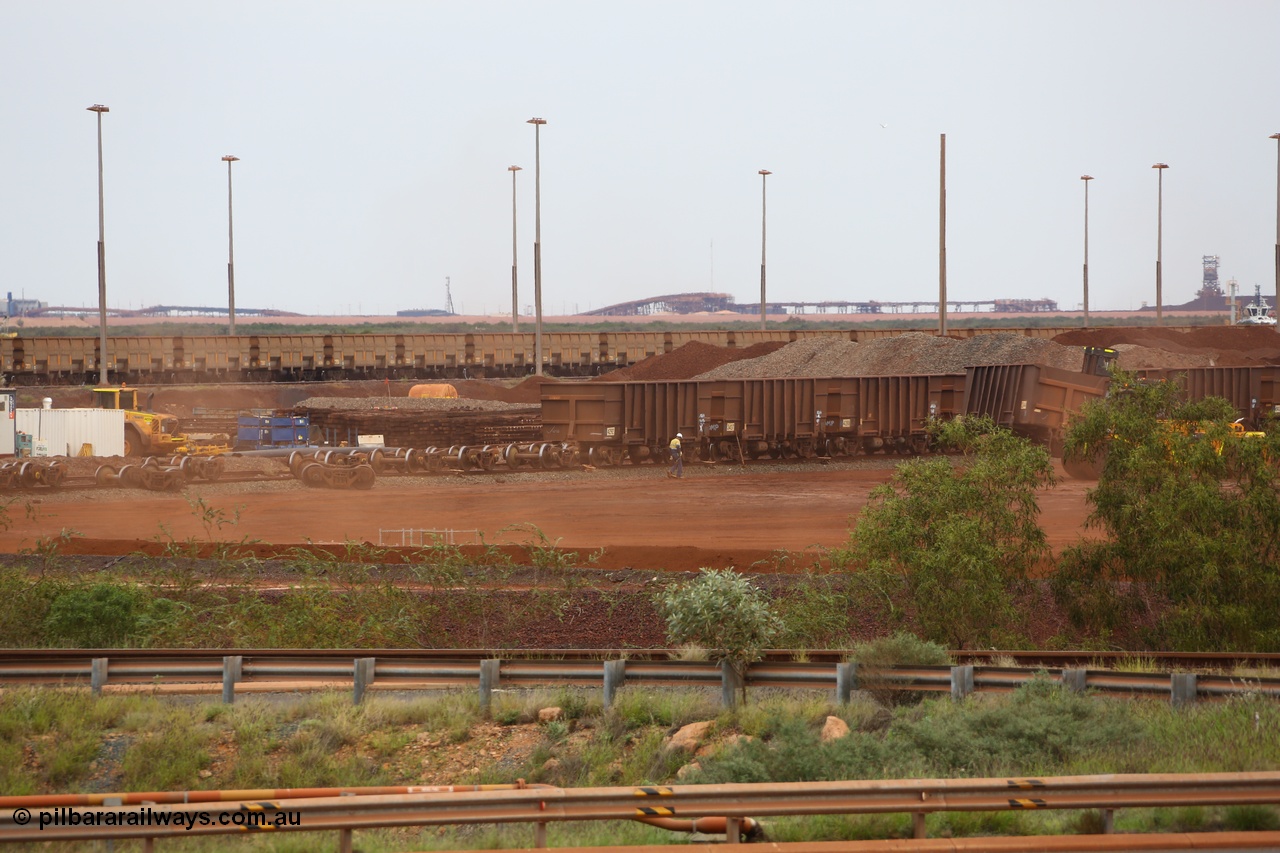 150523 8233
Nelson Point Yard, I Area, waggon scrapping by Sims Metal, a fork lift carries waggon no. 3340, old 38 TAL or tonne axle load bogies lay around while other cars await the chop. With the move to ECPB train brake control and heavy waggon loads these older style cars are fast becoming obsolete.
