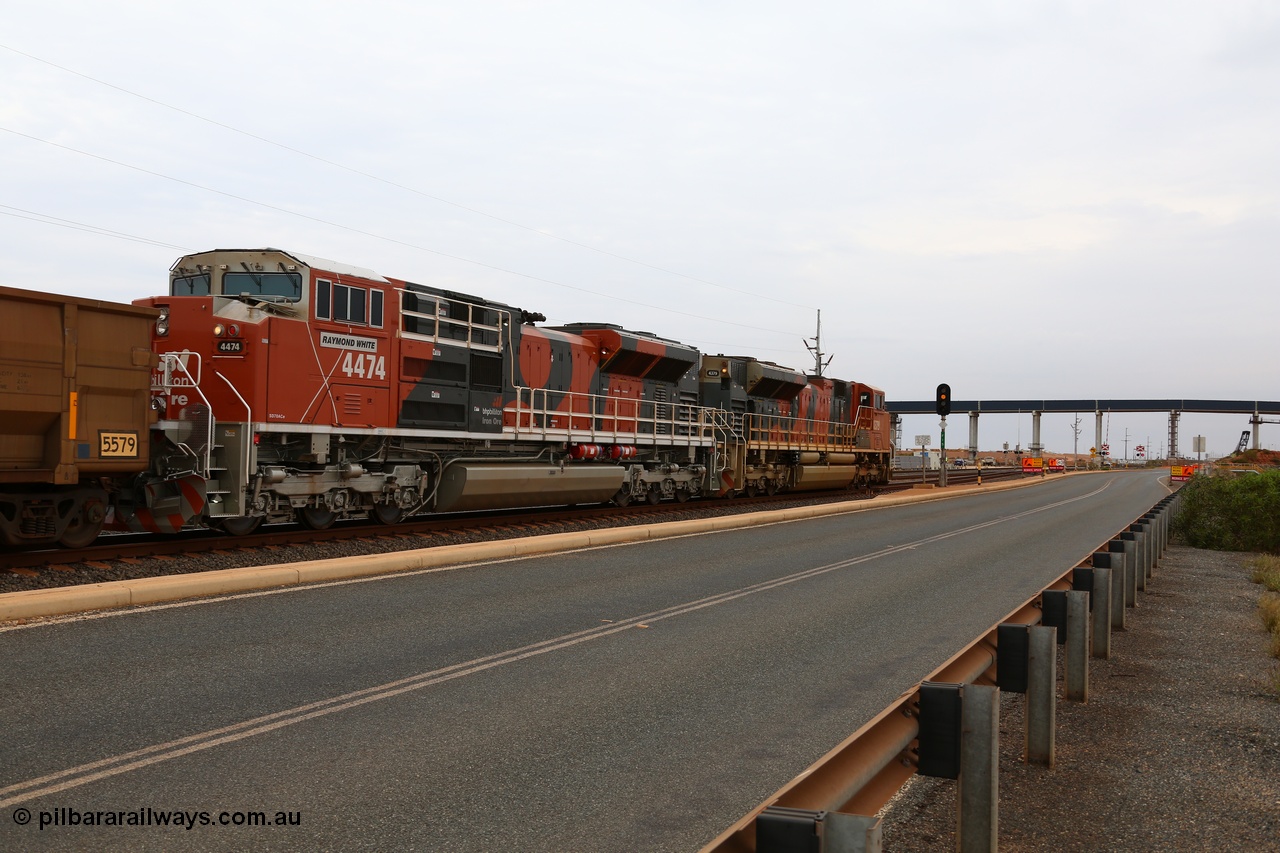 150523 8270
Finucane Island, empty train heading back to Boodarie behind Progress Rail EMD SD70ACe unit 4379 serial 20108424-006 and a newly arrived and named sibling 4474 'Raymond White' serial 20148001-007. View of 4474 looking south across grade crossing and new Roy Hill conveyor and road bridge. Geodata: [url=https://goo.gl/maps/3oDrc9JAS762] -20.3341700 118.5504083 [/url].
Keywords: 4474;Progress-Rail-Muncie-USA;EMD;SD70ACe/LCi;20148001-007;