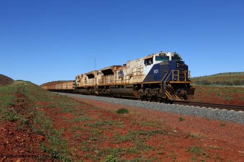 150505 7988
FMG Solomon Line, bank engines Progress Rail EMD SD70ACe/LCi unit 716 serial 20118693-008 and EMD SD90MAC unit 901 serial 976833-1, this unit has been repowered with an 16-710G3 prime mover, at the 227 km as they bank the loaded train upgrade into the cutting, the train speed is now increasing as the front of the train has topped the grade. Geodata: [url=https://goo.gl/maps/gSzXJkmY3ux] -22.0187117 118.5850933 [/url].
Keywords: FMG-716;Progress-Rail-Muncie-USA;EMD;SD70ACe/LCi;FMG-901;SD90MAC-H2;