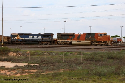 150523 8198
Nelson Point Yard, BHP Billiton SD70ACe unit 4334 'Wheelara' serial 20078915-001 built by Electro-Motive, London Ontario and Goninan rebuild CM40-8MEFI model unit 5666 'Taranto' serial 8412-11/94-157 wait on a loaded train in the arrival yard.
