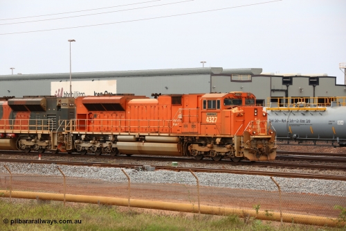 150523 8238
Nelson Point Yard, BHP Billiton SD70ACe unit leads a rake towards the dumpers. Lead unit 4327 'Hamersley' is from an order originally being built by Electro-Motive, London Ontario for BNSF, an US class 1 railroad, but BHP secured 10 of them during construction, this unit 4327 serial no. 20066862-056 was destined to be BNSF 9185 before coming to BHP.
