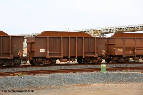 150523 8280
Finucane Island, loaded with Yandi Fines Comeng built original style ore waggon number 1483 dates from 1974. It has had the end sills filled in as a capacity improvement and show signs of having been re-sheeted and repaired, it is also riding on light weight 38 tonne bogies. Geodata: [url=https://goo.gl/maps/HUaomivQnAw] -20.3363567 118.5497550 [/url].
Keywords: Comeng-WA;BHP-ore-waggon;