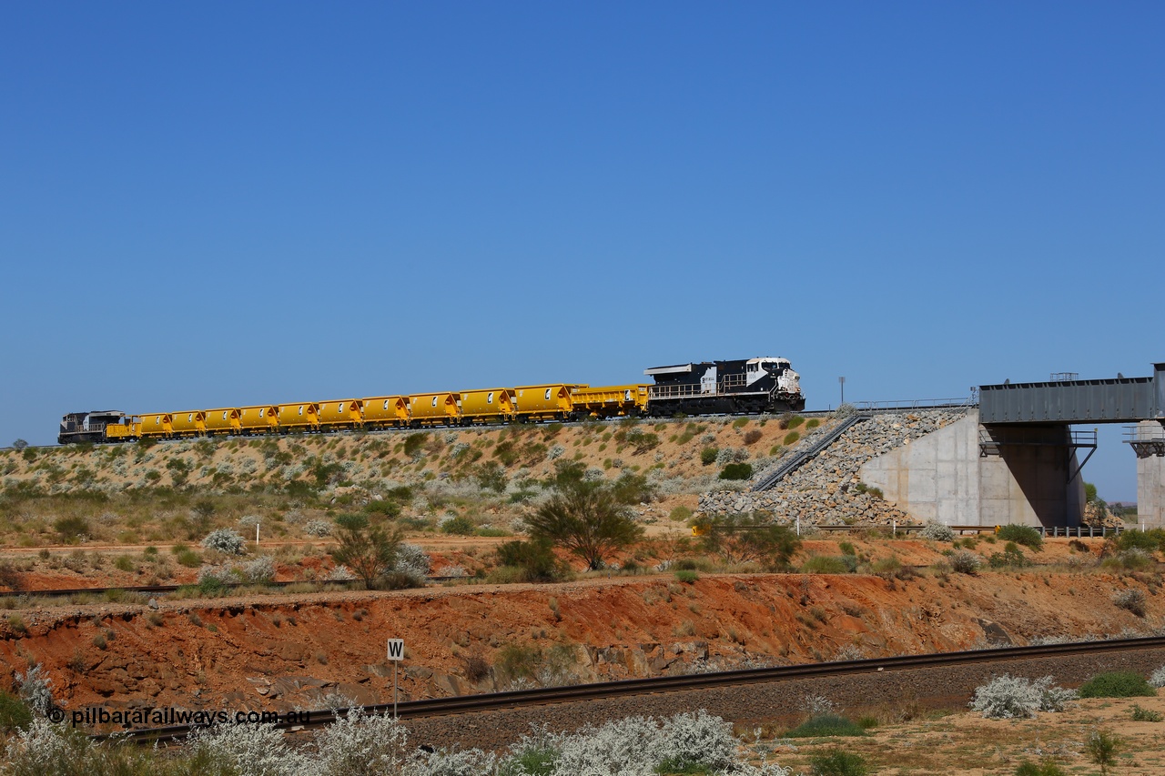 170727 9627
Woodstock Siding, a Roy Hill ballast train works north as it is about to cross BHP's Woodstock running lines, General Electric Erie built model ES44ACi unit RHA 1006 serial 62578 leads a side dump, ten ballast hoppers and a ballast plough with a sister unit on the rear. 27th July 2017. [url=https://goo.gl/maps/peEKeGz9sKS2]GeoData[/url].
Keywords: RHA-class;RHA1006;62578;GE;ES44ACi;