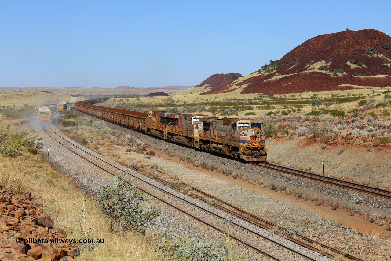 170728 09782
Green Pool on the Robe line at the 60.75 km original order and now aging General Electric built Dash 9-44CW model locomotive 7091 serial 47770 is operating in AutoHaul™ mode with a pair of GE ES44DCi units 8155 and 8165 both in the Rio Tinto stripe livery as they pass a tamper and regulator doing track work. 28th July 2017. [url=https://goo.gl/maps/HF3aQMYkX4u]GeoData[/url].
Keywords: 7091;GE;Dash-9-44CW;47770;