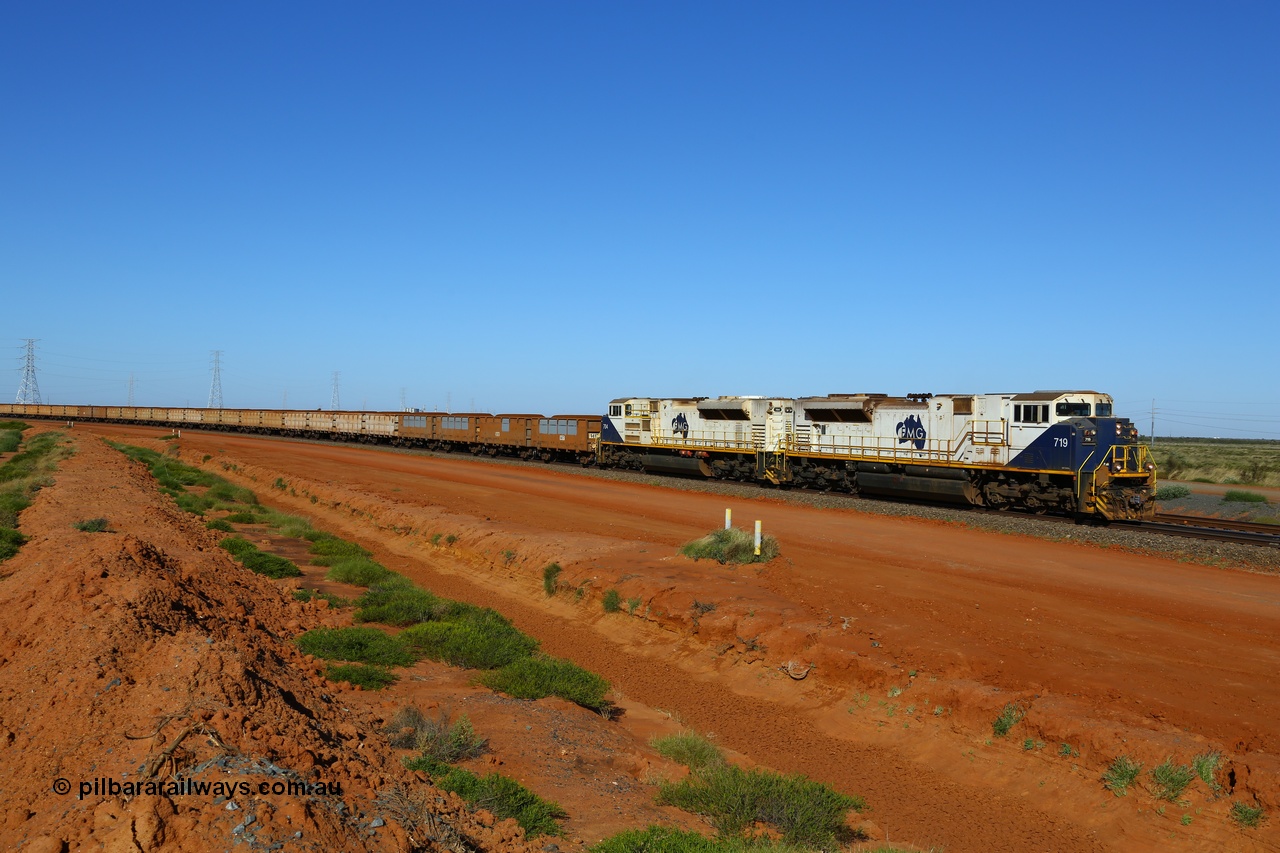 170730 0435
Boodarie, a loaded FMG iron ore train rounds the large curve at the 5 km as it approaches the car dumper balloon loops behind Progress Rail Muncie USA built SD70ACe/LCi unit 719 serial 20118693-011 and sister 704 with the first four waggons showing panel repairs and re-lining recently undertaken. 30th July 2017. [url=https://goo.gl/maps/phdYswaU3BR2]GeoData[/url].
Keywords: FMG-719;Progress-Rail-Muncie-USA;EMD;SD70ACe/LCi;20118693-011;