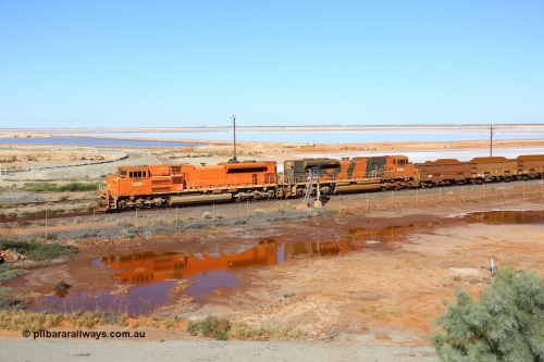 170726 9429
Redbank, a loaded BHP iron ore train from Yandi arrives past the arrival signals for Nelson Point yard on the west mainline behind Electro Motive built SD70ACe unit 4331 'Withnell' serial 20066862-060 leading an SD70ACe/LC with another two SD70ACe/LC units in the middle of the 264 waggon consist. 26th July 2017.
Keywords: 4331;Electro-Motive-London-Ontario;EMD;SD70ACe;20066862-060;