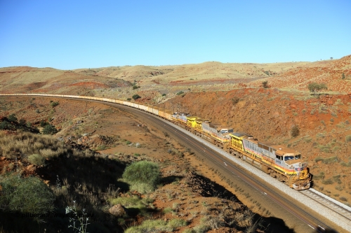 170728 09974
Benson Falls, 91 km curve, an empty train blasts up the steep grade behind a triple all General Electric built Dash 9-44CW unit power of 9409 serial 54159 and 9408 both in Pilbara Rail with Robe reporting marks, and 7060 in Pilbara Iron with HI reporting marks. July 28, 2017. [url=https://goo.gl/maps/5Krz1ULwNex]GeoData[/url].
Keywords: 9409;GE;Dash-9-44CW;54159;