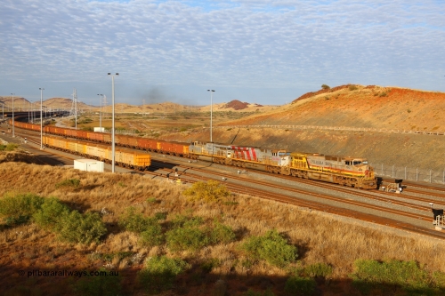 170729 0065
Cape Lambert South yard, a loaded train heads towards car dumper 7 behind General Electric built Dash 9-44CW unit 7043 serial 57094 wearing Pilbara Iron livery with HI reporting marks and two General Electric built ES44DCi units 8153 and 8107. July 29, 2017. [url=https://goo.gl/maps/oF6KMPRRAgx]GeoData[/url].
Keywords: 7043;GE;Dash-9-44CW;57094;HI-Pilbara-Iron;