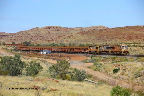 170729 0145
Emu Siding, a loaded Rio Tinto train rolls down grade past the signals at the 74.8 km West Mainline behind Rio Tinto stripe liveried General Electric built ES44DCi unit 8194 serial 61853 and plain silver sister unit 8111 and Dash 9-44CW stablemate 7055 as they head to the Cape Lambert port for unloading. July 29, 2017. [url=https://goo.gl/maps/ad5sT7twQUq]GeoData[/url]
Keywords: 8194;GE;ES44DCi;61853;