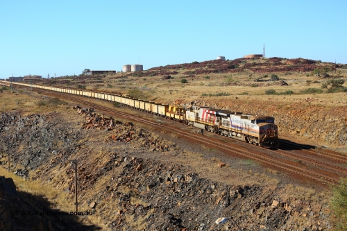 170729 0322
Parker Point, an empty train is worked back towards Seven Mile yard along the Empty Car Line behind General Electric built Dash 9-44CW unit 7069 serial 47748 in the original Hamersley Iron livery from 1994 and ES44DCi unit 8195. July 29, 2017. [url=https://goo.gl/maps/26rFPJ7MdWK2]GeoData[/url].
Keywords: 7069;GE;Dash-9-44CW;47748;