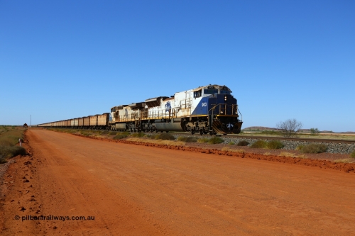 170730 0482
Indee, a loaded FMG iron ore train crosses Indee Rd grade crossing at the 48 km as it runs to the port behind NS Juniata Shops rebuild EMD SD90MAC-H unit 903 serial 976833-18 and General Electric built Dash 9-44CW class leader unit 001. 903 had the 245-H engine replaced with a 710 in 2014. The line to the right is the Roy Hill line. 30th July 2017. [url=https://goo.gl/maps/8SQqrFhdycC2]GeoData[/url].
Keywords: FMG-903;NS-Juniata-Shops-USA;EMD;SD90MAC-H2;976833-18;