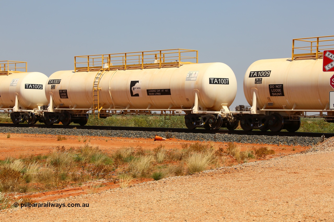 170915 0714
At the 18.2 km as part of the empty Roy Hill fuel train, TA type diesel fuel tank waggon TA 1007 built by CSR Yangtze Rolling Stock Co China with a capacity of 96000 litres. 15th September 2017. [url=https://goo.gl/maps/DR61N4rDVZy]View map here[/url].
Keywords: TA-Type;TA1007;CSR-Yangtze-Rolling-Stock-Co-China;Roy-Hill-Tank-Waggon;