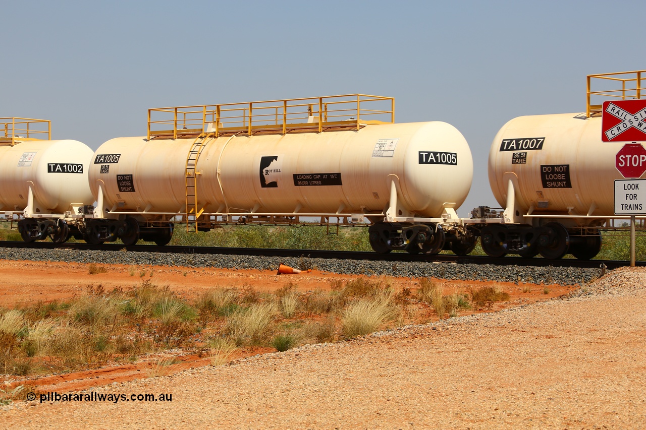 170915 0715
At the 18.2 km as part of the empty Roy Hill fuel train, TA type diesel fuel tank waggon TA 1005 built by CSR Yangtze Rolling Stock Co China with a capacity of 96000 litres. 15th September 2017. [url=https://goo.gl/maps/DR61N4rDVZy]View map here[/url].
Keywords: TA-Type;TA1005;CSR-Yangtze-Rolling-Stock-Co-China;Roy-Hill-Tank-Waggon;