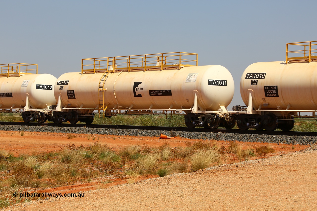 170915 0718
At the 18.2 km as part of the empty Roy Hill fuel train, TA type diesel fuel tank waggon TA 1011 built by CSR Yangtze Rolling Stock Co China with a capacity of 96000 litres. 15th September 2017. [url=https://goo.gl/maps/DR61N4rDVZy]View map here[/url].
Keywords: TA-Type;TA1011;CSR-Yangtze-Rolling-Stock-Co-China;Roy-Hill-Tank-Waggon;