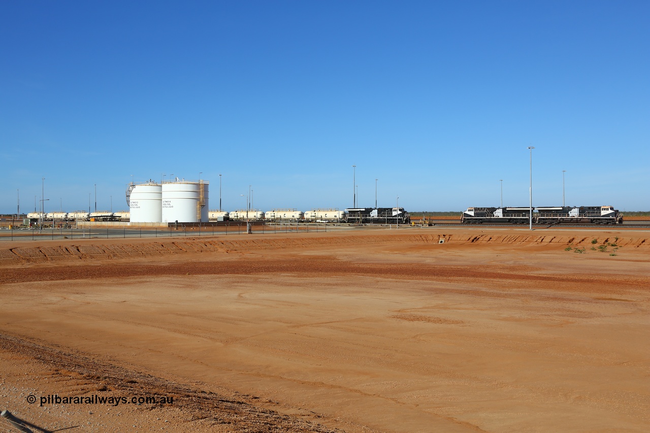 171018 0957
Tad Yard, overview of Roy Hill's fuel tanks and waggon loading gantry with a fuel train being loaded headed up by ES44ACi unit RHA 1020 serial number 64301 and sister units RHA 1015 serial number 63826 with RHA 1017 serial number 63828 awaiting their next call to duty. All three RHA units were built in Erie Pennsylvania, USA by General Electric. 17th October 2018.
Keywords: RHA-class;RHA1017;GE;ES44ACi;63828;