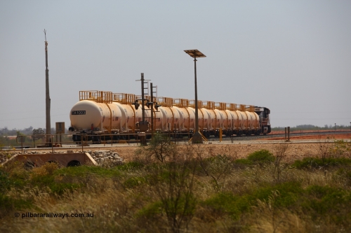 170915 0724
Great Northern Highway 18.2 km grade crossing, empty Roy Hill fuel train powers away north from the highway towards Tad Yard with General Electric built ES44ACi unit RHA 1019 leading eleven of Roy Hill's twelve tank waggons. 15th September 2017. [url=https://goo.gl/maps/DR61N4rDVZy]View map here[/url].
