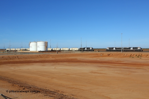 171018 0957
Tad Yard, overview of Roy Hill's fuel tanks and waggon loading gantry with a fuel train being loaded headed up by ES44ACi unit RHA 1020 serial number 64301 and sister units RHA 1015 serial number 63826 with RHA 1017 serial number 63828 awaiting their next call to duty. All three RHA units were built in Erie Pennsylvania, USA by General Electric. 17th October 2018.
Keywords: RHA-class;RHA1017;GE;ES44ACi;63828;