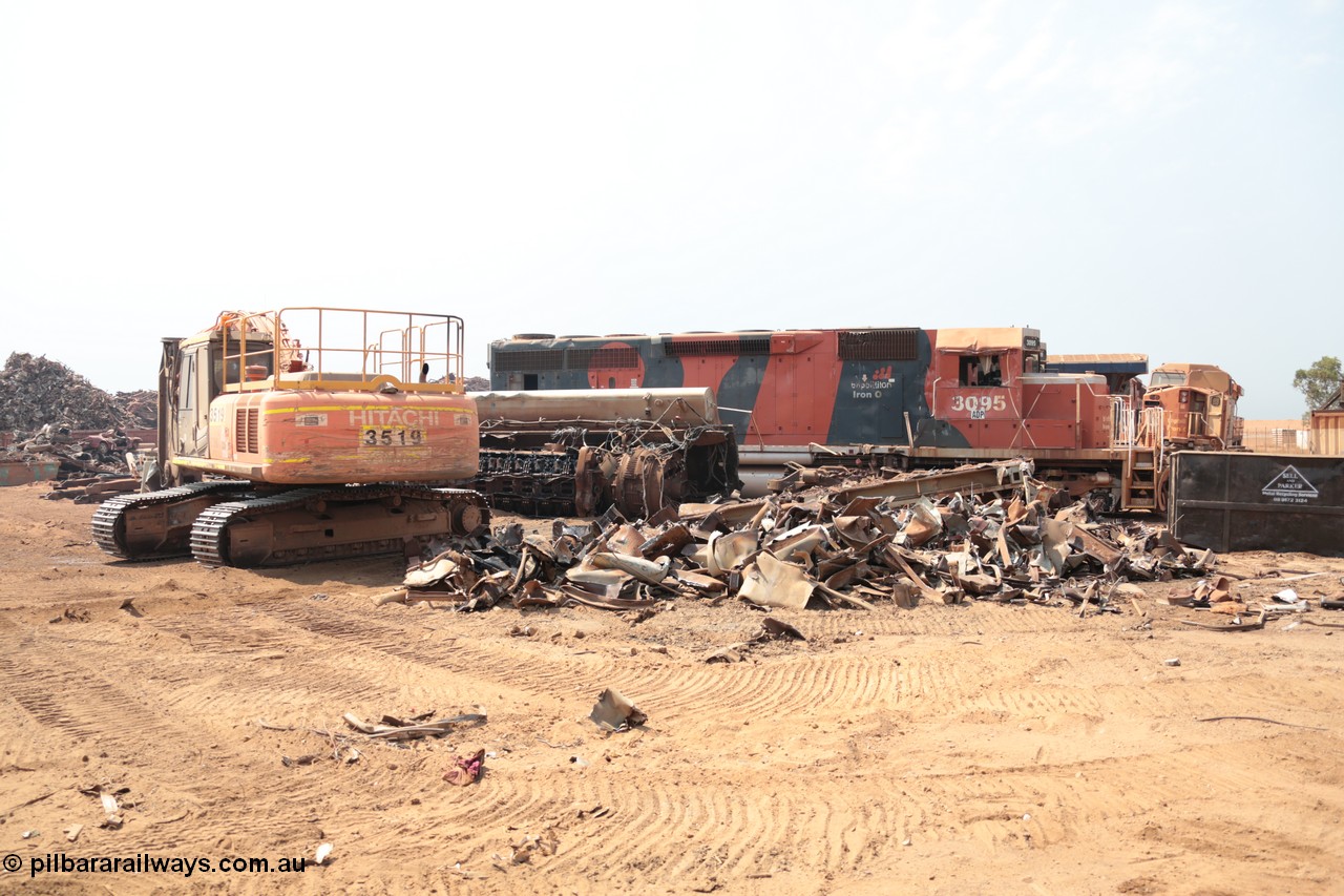 141027 5834
Wedgefield, Sell and Parker's metal recycling yard, view of EMD SD40R unit 3095 serial 33677/7083-7 watching a former sister unit being reduced to bits, a primer mover 645 EMD engine and fuel tank tipped on its side, and the excavator with the hydraulic shears.
Keywords: 3095;EMD;SD40R;33677/7083-7;SD40;SP8485;