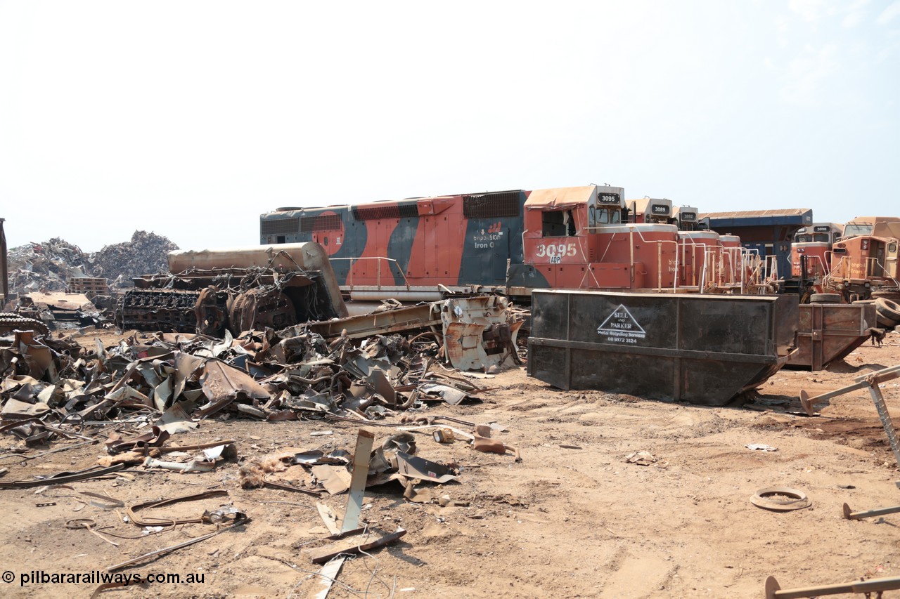 141027 5839
Wedgefield, Sell and Parker's metal recycling yard, view of EMD SD40R unit 3095 serial 33677/7083-7 watching a former sister unit being reduced to bits, a primer mover 645 EMD engine and fuel tank tipped on its side, and the excavator with the hydraulic shears.
Keywords: 3095;EMD;SD40R;33677/7083-7;SD40;SP8485;