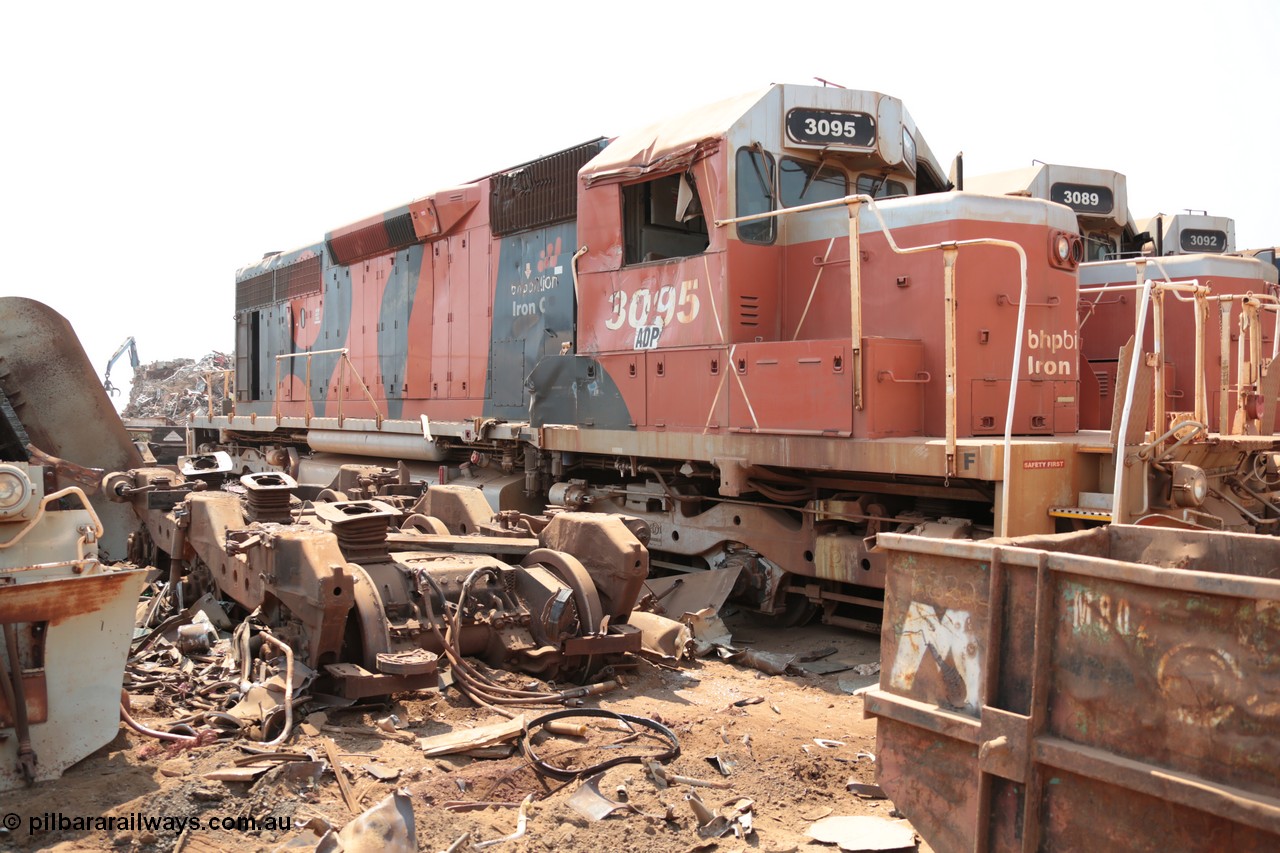 141027 5852
Wedgefield, Sell and Parker's metal recycling yard, view of EMD SD40R unit 3095 serial 33677/7083-7 watching a former sister unit being reduced to bits, a primer mover 645 EMD engine and fuel tank tipped on its side, pilot and bogie, and the excavator with the hydraulic shears.
Keywords: 3095;EMD;SD40R;33677/7083-7;SD40;SP8485;