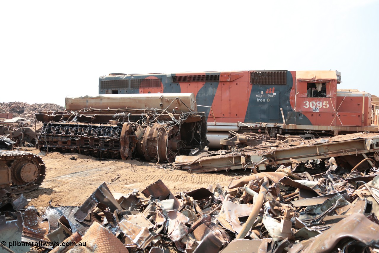 141027 5859
Wedgefield, Sell and Parker's metal recycling yard, view of EMD SD40R unit 3095 serial 33677/7083-7 watching a former sister unit being reduced to bits, a primer mover 645 EMD engine and fuel tank tipped on its side, pilot and bogie, and the excavator with the hydraulic shears.
Keywords: 3095;EMD;SD40R;33677/7083-7;SD40;SP8485;