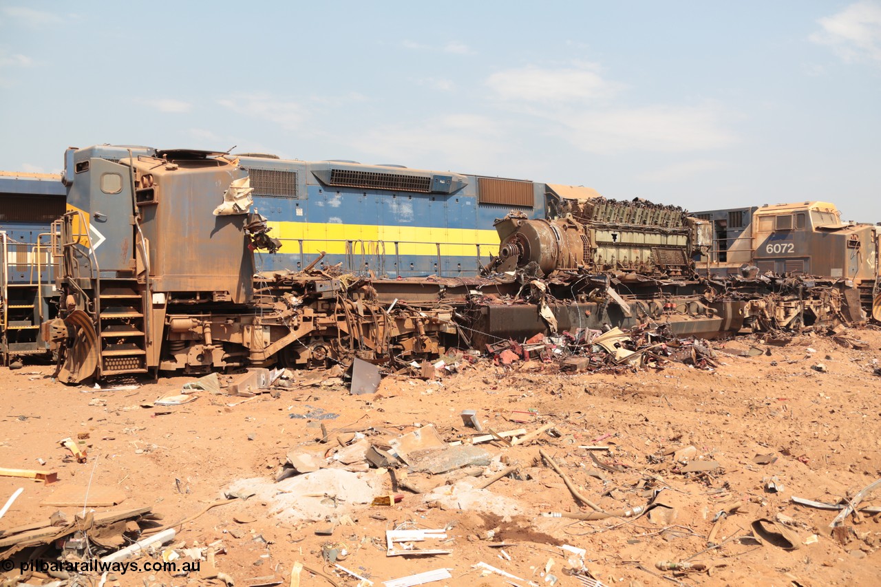 141027 5882
Wedgefield, Sell and Parker's metal recycling yard, General Electric AC6000 unit 6071 serial 51063 is reduced to frame level with only the nose which contains the collision posts and the 6600 hp EVO motor and alternator awaiting the thermal lance.
Keywords: 6071;GE;AC6000;51063;