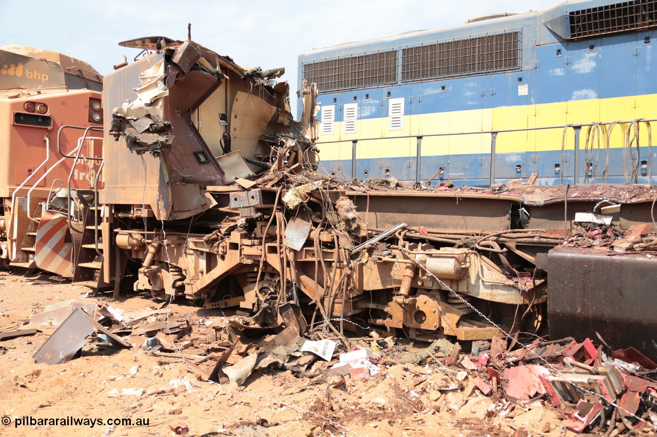 141027 5887
Wedgefield, Sell and Parker's metal recycling yard, General Electric AC6000 unit 6071 serial 51063 is reduced to frame level with only the nose which contains the collision posts awaiting the thermal lance.
Keywords: 6071;GE;AC6000;51063;