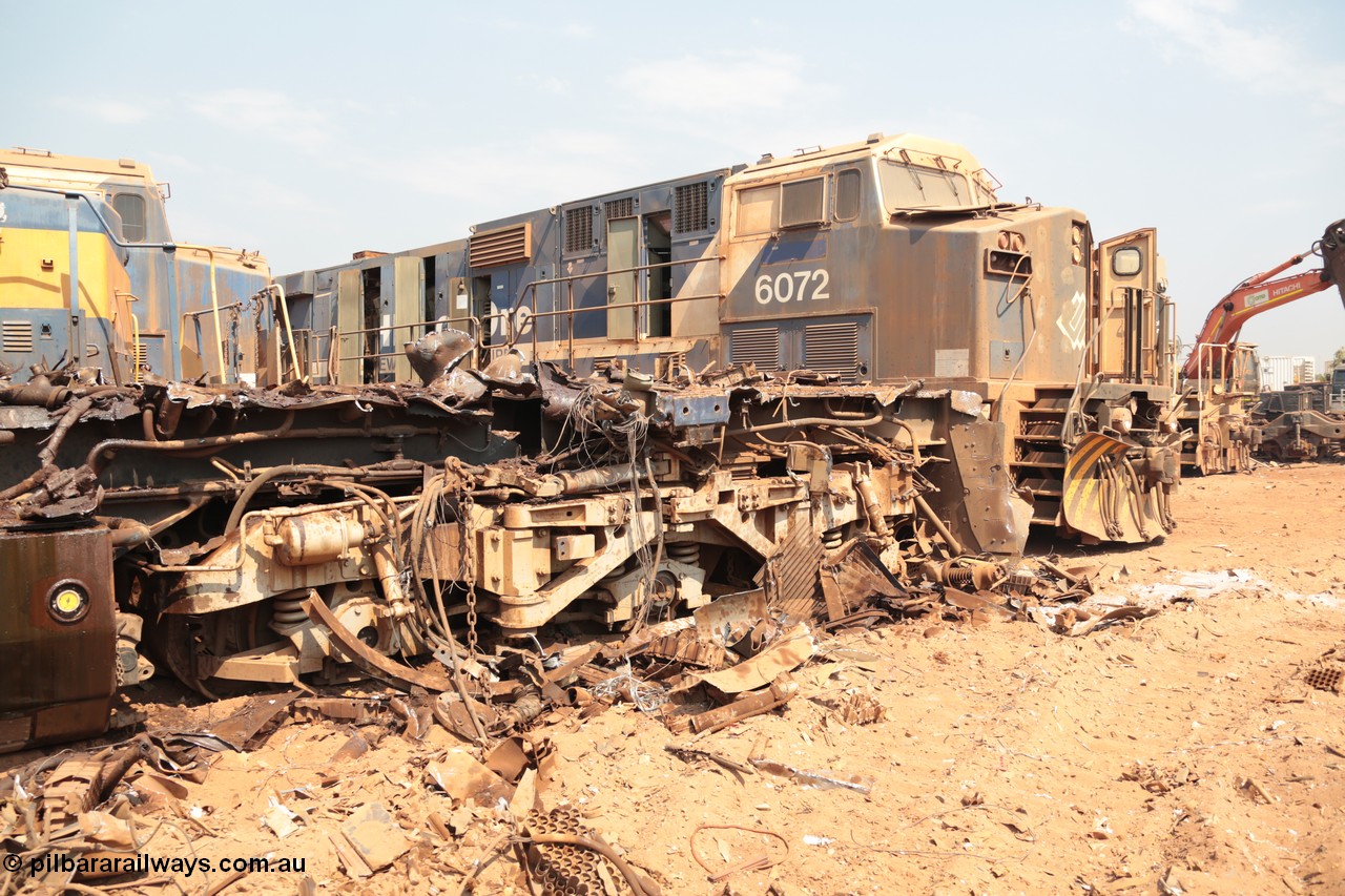 141027 5889
Wedgefield, Sell and Parker's metal recycling yard, view of the trailing bogie and frame of GE AC6000 unit 6071 as sister unit 6972 awaits the same treatment.
Keywords: 6071;GE;AC6000;51063;