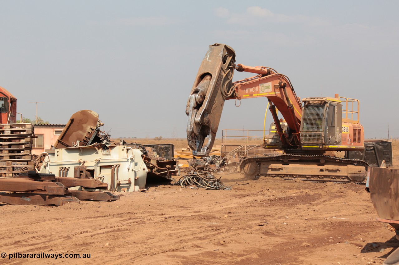 141027 5913
Wedgefield, Sell and Parker's metal recycling yard, view of Hitachi ZAXIS 350 LCH excavator fitted with the huge hydraulically operated shears that are making a meal of former EMD SD40 and GE AC6000 locomotives. Besides it lays the remains of an EMD SD40R unit which has been reduced to a few frame part with the EMD 645 engine laying over.
