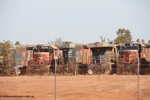141025 5820
Wedgefield, WA, view from the new bypass road looking into the rear of Sell and Parker's metal recycling yard with former BHP Billiton Iron Ore EMD SD40R and GE AC6000 model units lined up awaiting their fate, from left, EMD SD40R 3088, 3086, 3094, AC6000 6075, SD40R 3091.
Keywords: SD40R;3086;3094;3091;EMD;31491;31515/7861-25;31496/7861-6;