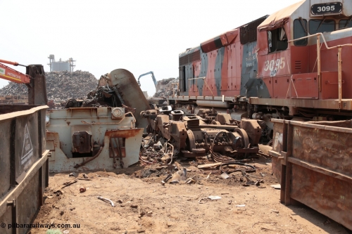 141027 5841
Wedgefield, Sell and Parker's metal recycling yard, view of EMD SD40R unit 3095 serial 33677/7083-7 watching a former sister unit being reduced to bits, a primer mover 645 EMD engine and fuel tank tipped on its side, pilot and bogie, and the excavator with the hydraulic shears.
Keywords: 3095;EMD;SD40R;33677/7083-7;SD40;SP8485;