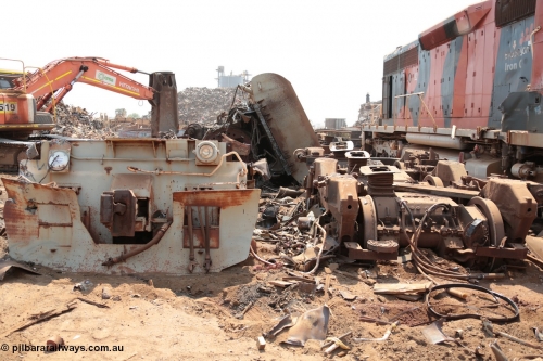 141027 5853
Wedgefield, Sell and Parker's metal recycling yard, view of and EMD SD40R unit primer mover 645 EMD engine and fuel tank tipped on its side, pilot and bogie.
